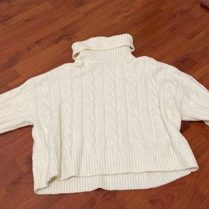 Slightly cropped, turtleneck cable knit sweater